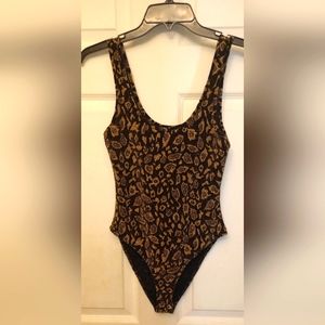Forever 21 stretchy fabric animal print snap one piece. Size small. Never worn.